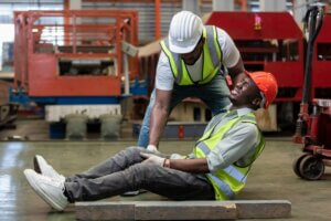 Man Holding His Leg From Injury